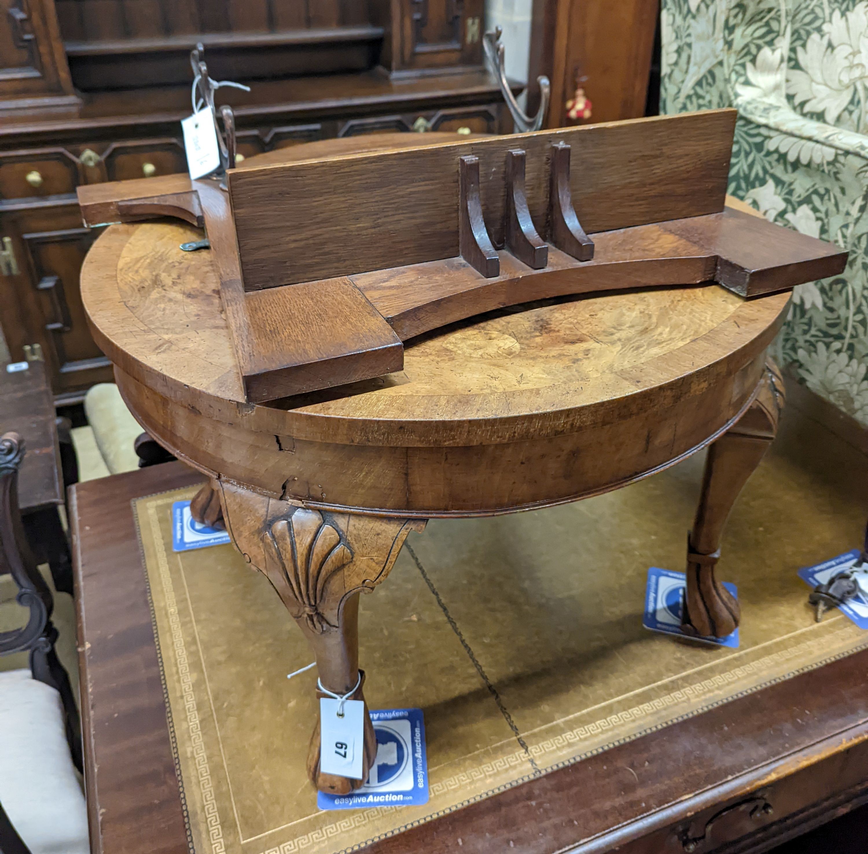 A Queen Anne revival circular walnut occasional table, diameter 60cm, height 40cm together with an Arts & Crafts mirrored oak coat rack